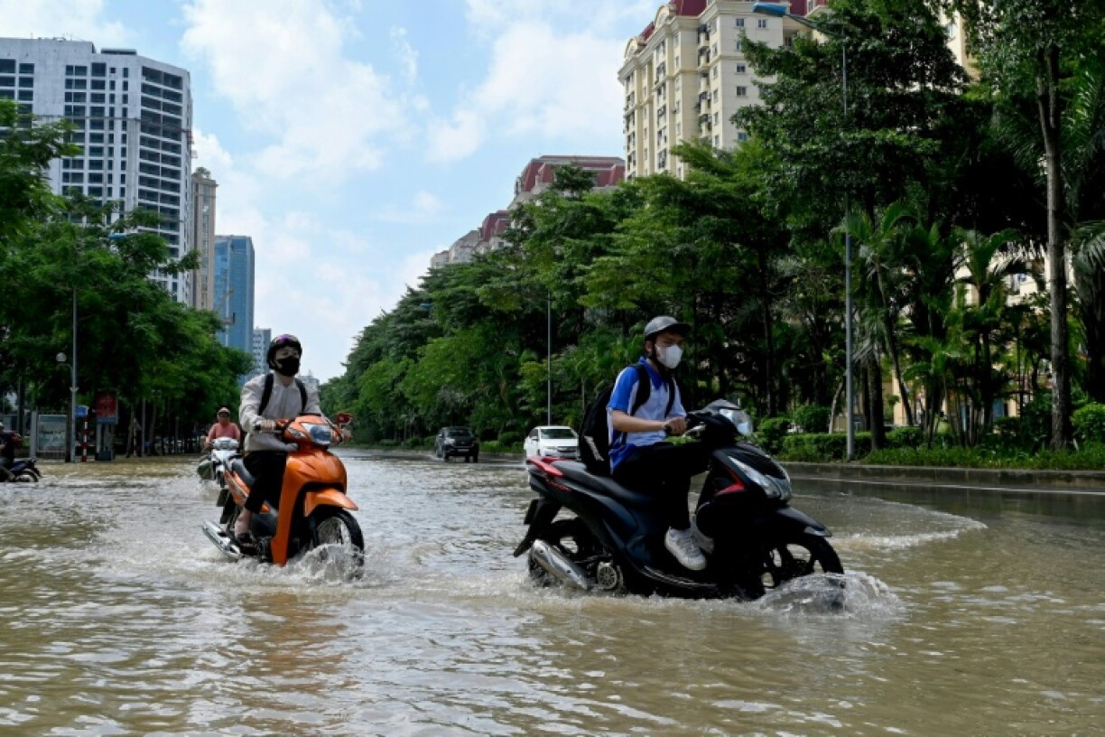 Heavy rain from the storm inundated the capital Hanoi this week, and floods and landslides damaged homes, infrastructure and farmland across the country