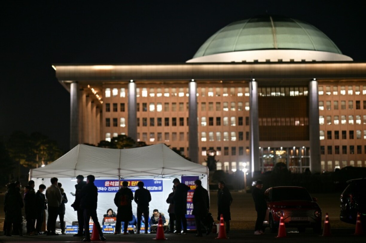 Demonstrators take part in a sit-in protest calling for the ouster of South Korea President Yoon Suk Yeol on the grounds of the National Assembly in Seoul