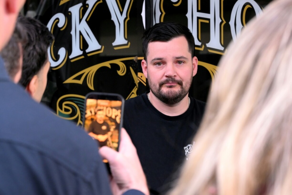 Barber Ricky Jefferies speaks to the media a day after tackling a man who attacked Australian politician Helen Haines in the northern regional city of Wangaratta, about 250 kilometres north-east of Melbourne on October 20, 2026