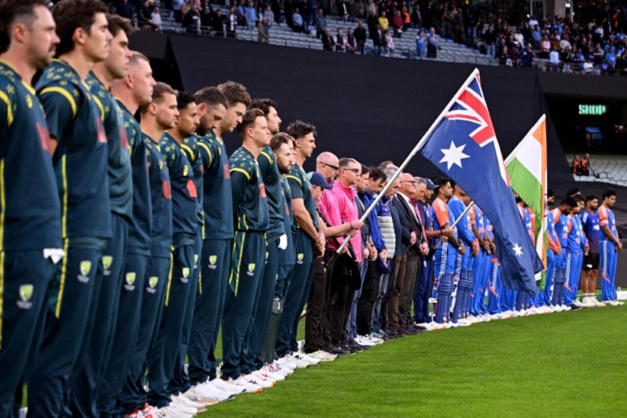 Players observe a minute's silence for young cricketer Ben Austin