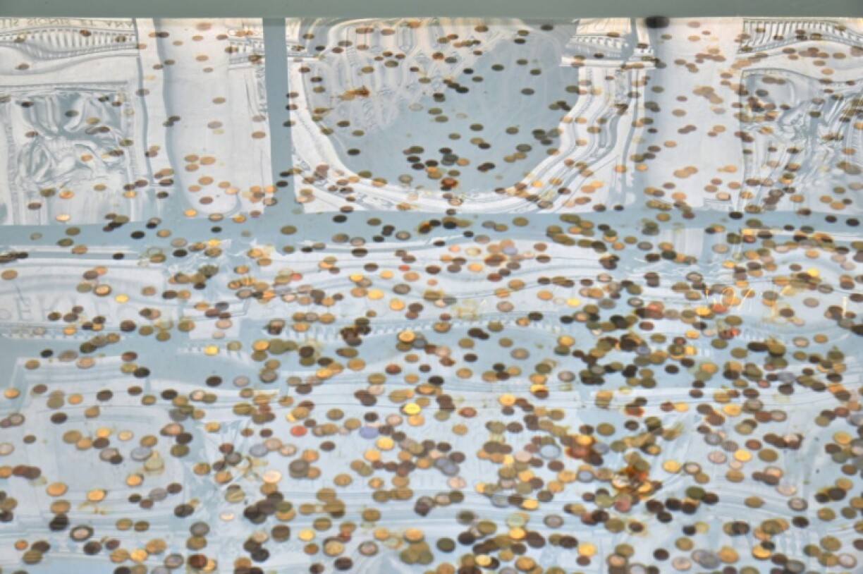 Making a wish and tossing a coin into the water is a tradition at the fountain