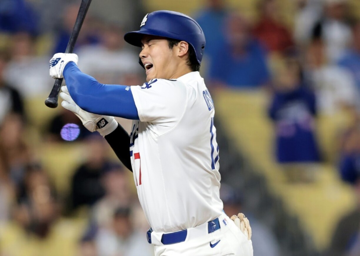 Shohei Ohtani of the Los Angeles Dodgers is hit by a pitch from San Diego's Robert Suarez, who was issued a three-game suspension by Major League Baseball over the incident, a ban Suarez is appealing