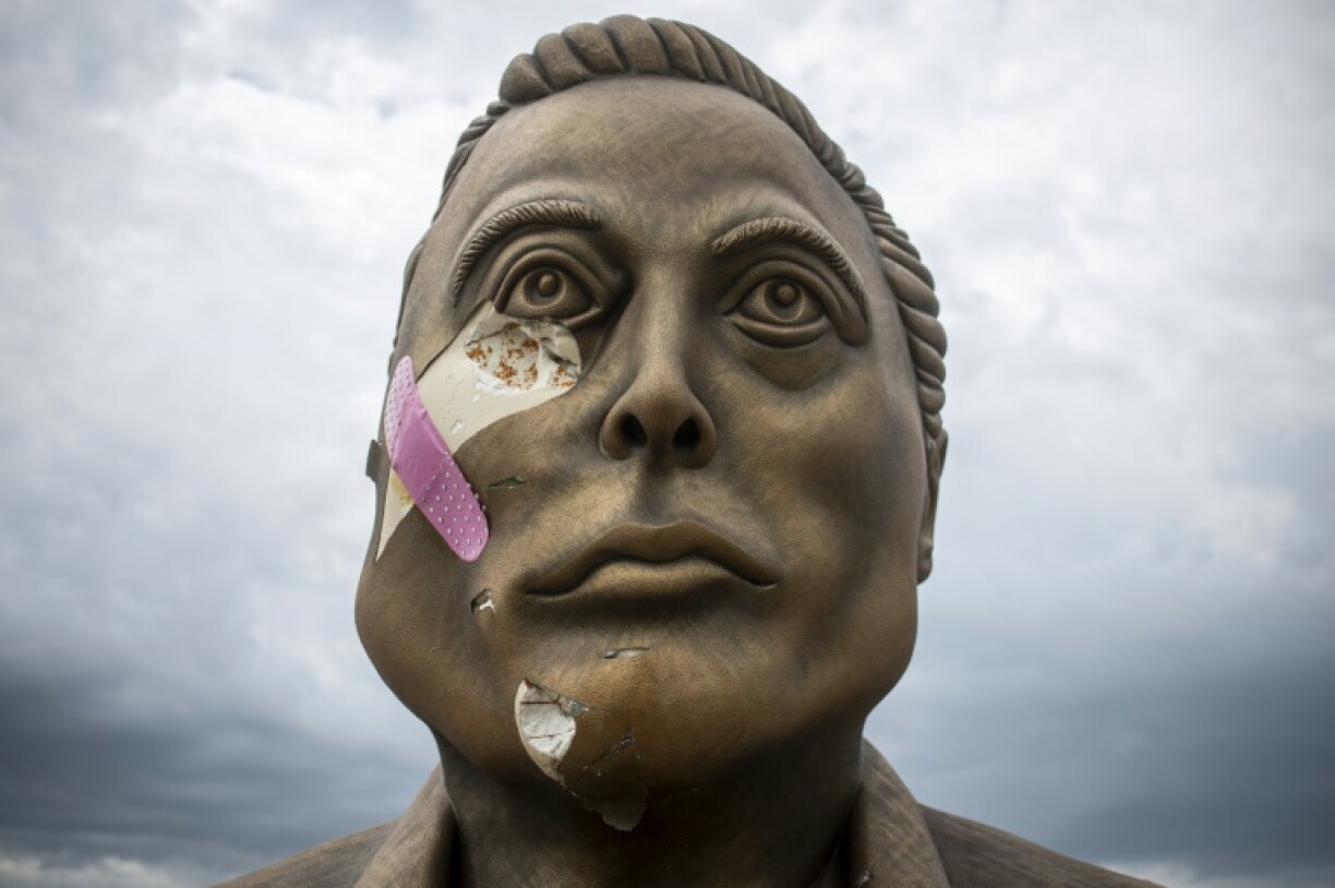 A damaged bust of Elon Musk