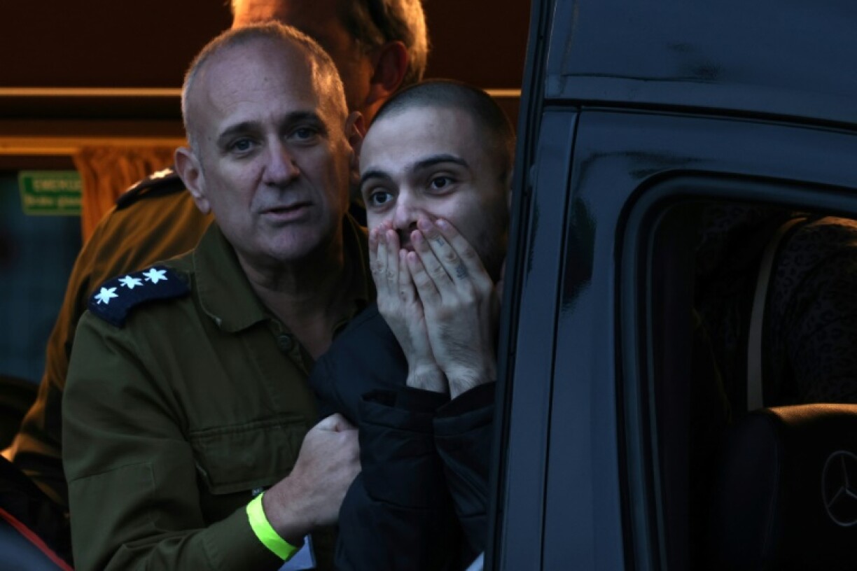 Newly released Israeli hostage Omer Wenkert reacts as a military helicopter takes him to hospital upon release from Gaza