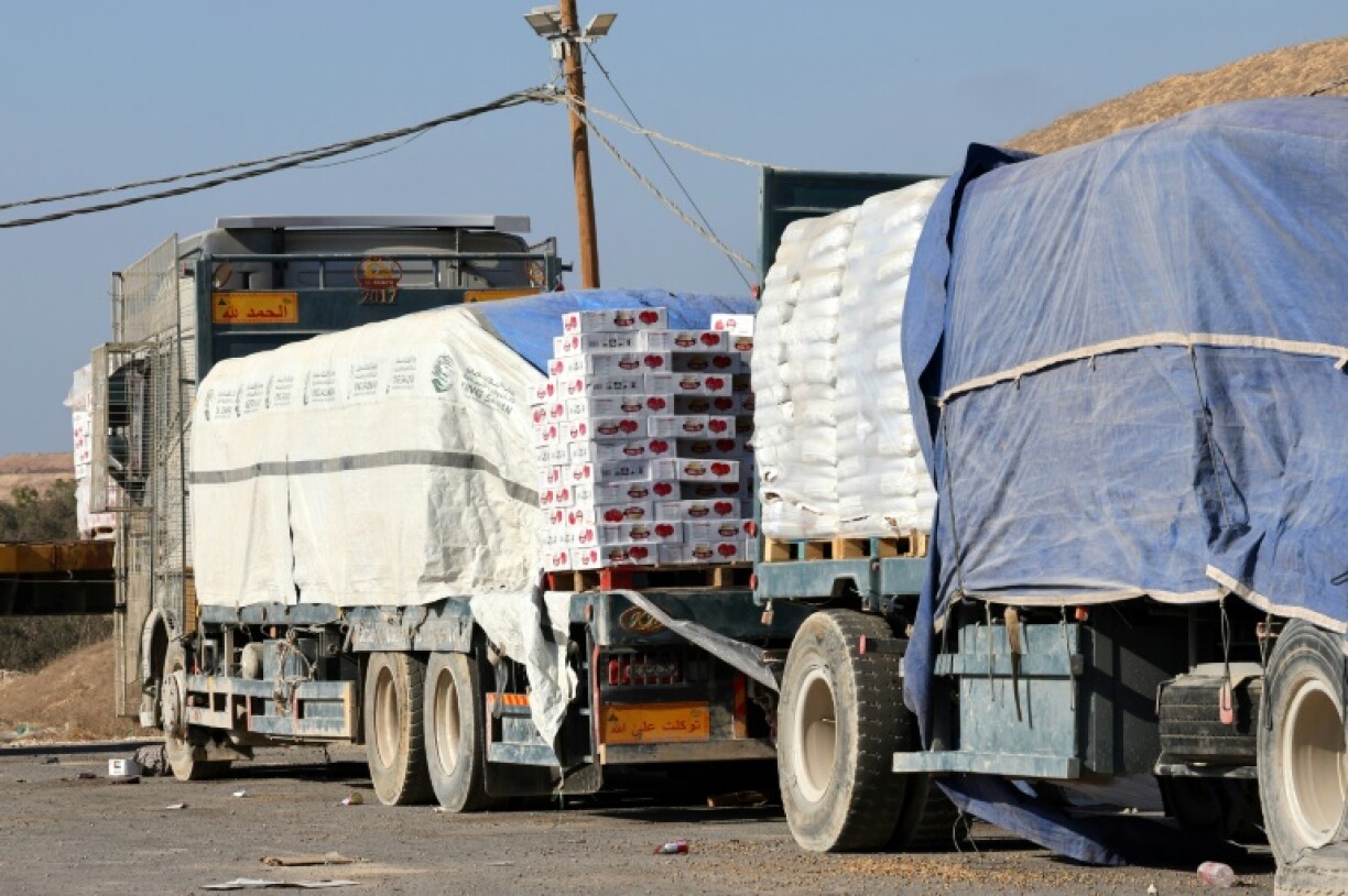 Trucks loaded with humanitarian aid for Palestinians in Gaza lie abandoned near the border with the Gaza Strip, close to the Kissufim crossing in southern Israel, on August 21, 2025