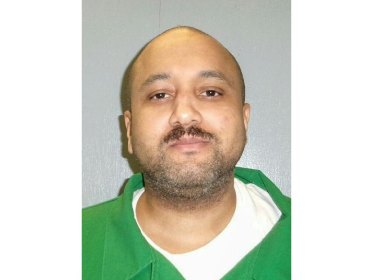 Mikal Mahdi, 42, was executed by firing squad for the 2004 murder of an off-duty police officer and a convenience store worker