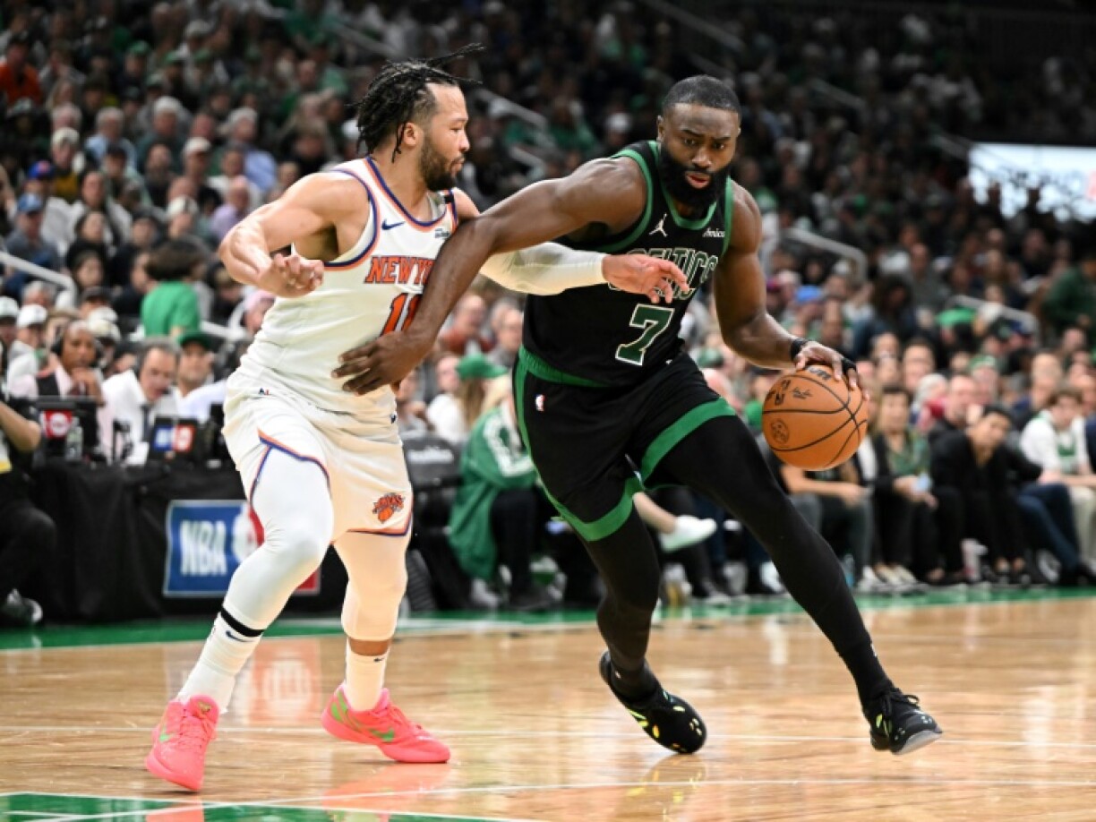 Boston's Jaylen Brown (right) holds off Jalen Brunson as the Celtics score a crucial win over the New York Knicks