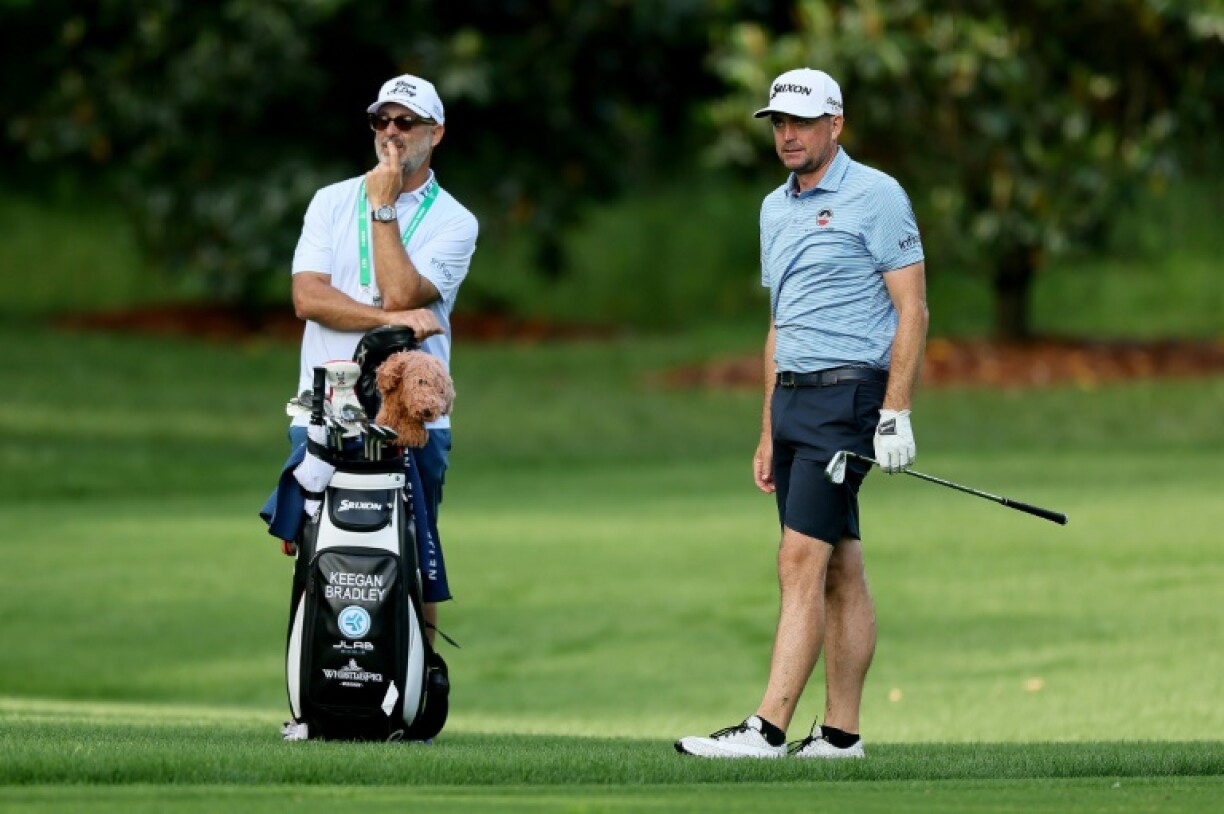 US 2025 Ryder Cup captain Keegan Bradley, right, watches a shot with caddie Scott Vail just as he will watch prospects for his team in this week's 107th PGA Championship at Quail Hollow