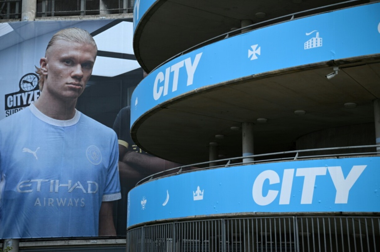 A poster of Manchester City striker Erling Haaland is pictured outside The Etihad Stadium