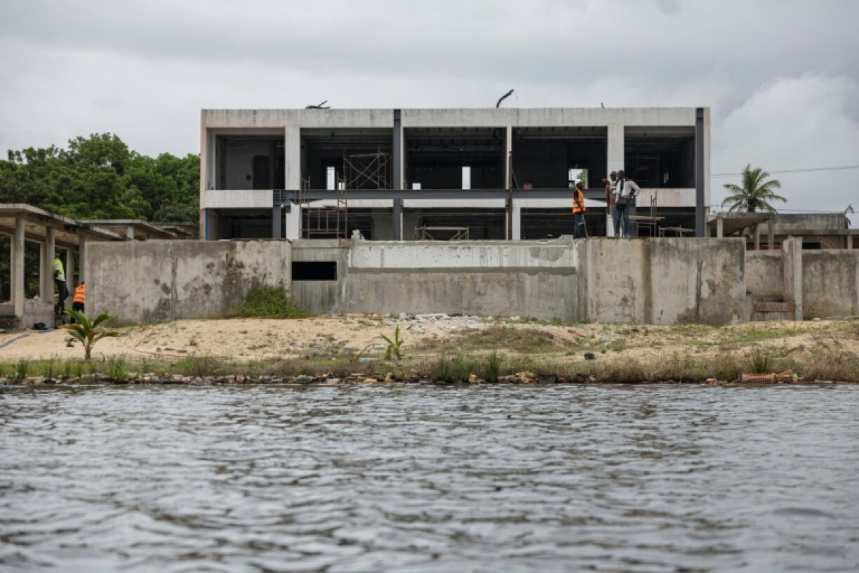 Once shimmering swimming pools stand stagnant at some villas -- although a local councillor dubs Assinie