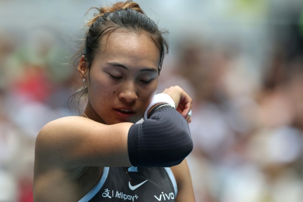 China's Zheng Qinwen reacts after being knocked out of the Australian Open