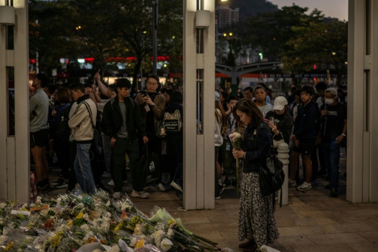 Thousands of people arrived to pay their respects to victims lost in Hong Kong's deadliest fire in decades after a three-day moruning period was announced