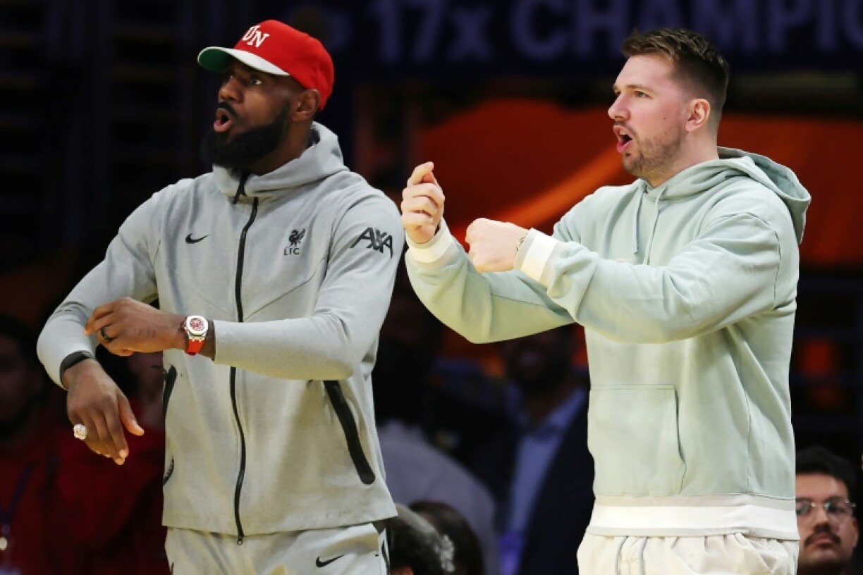 New Los Angeles Lakers teammates Luka Doncic, right, and LeBron James, left, are set to provide a boost for the NBA club, which resumes play after the All-Star break on Wednesday