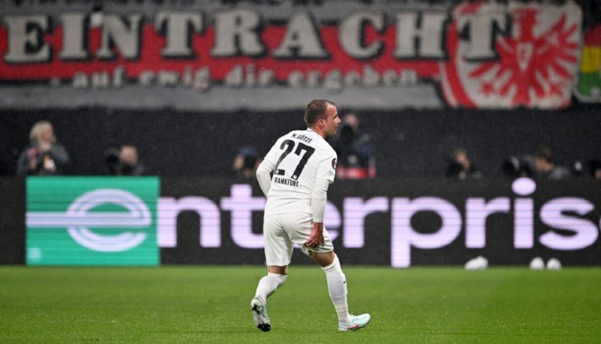 Eintracht Frankfurt midfielder Mario Goetze grabs his injured hamstring