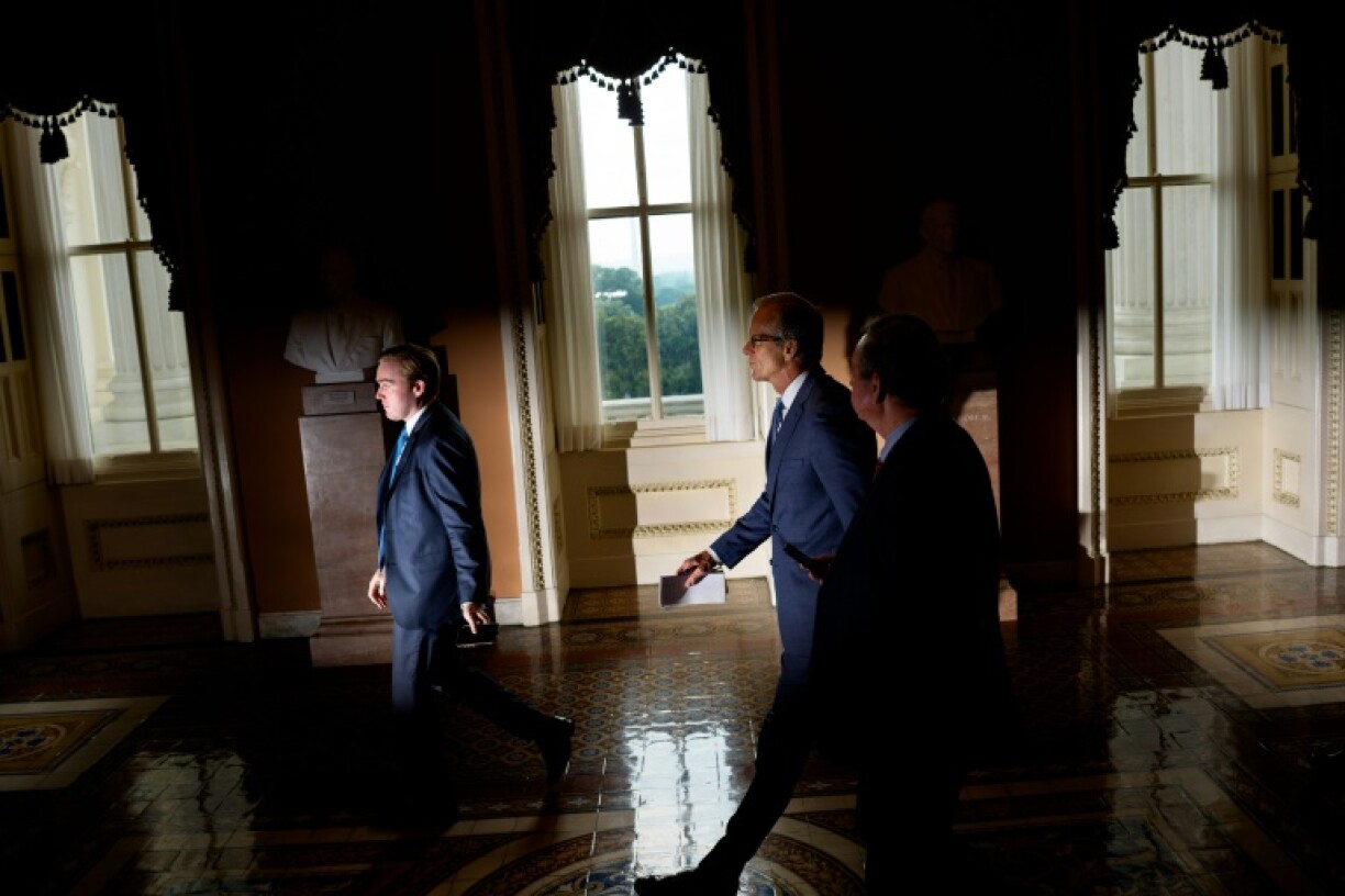 Senate Majority Leader John Thune (2nd R) marhsalled the votes to pass President Donald Trump's sweeping tax cut legislation