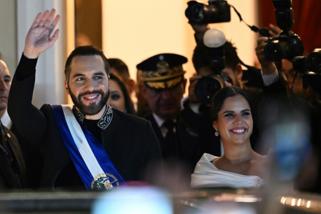 El Salvador's President Nayib Bukele and his wife Gabriela Rodriguez leave the National Theater a speech marking one year into his second term