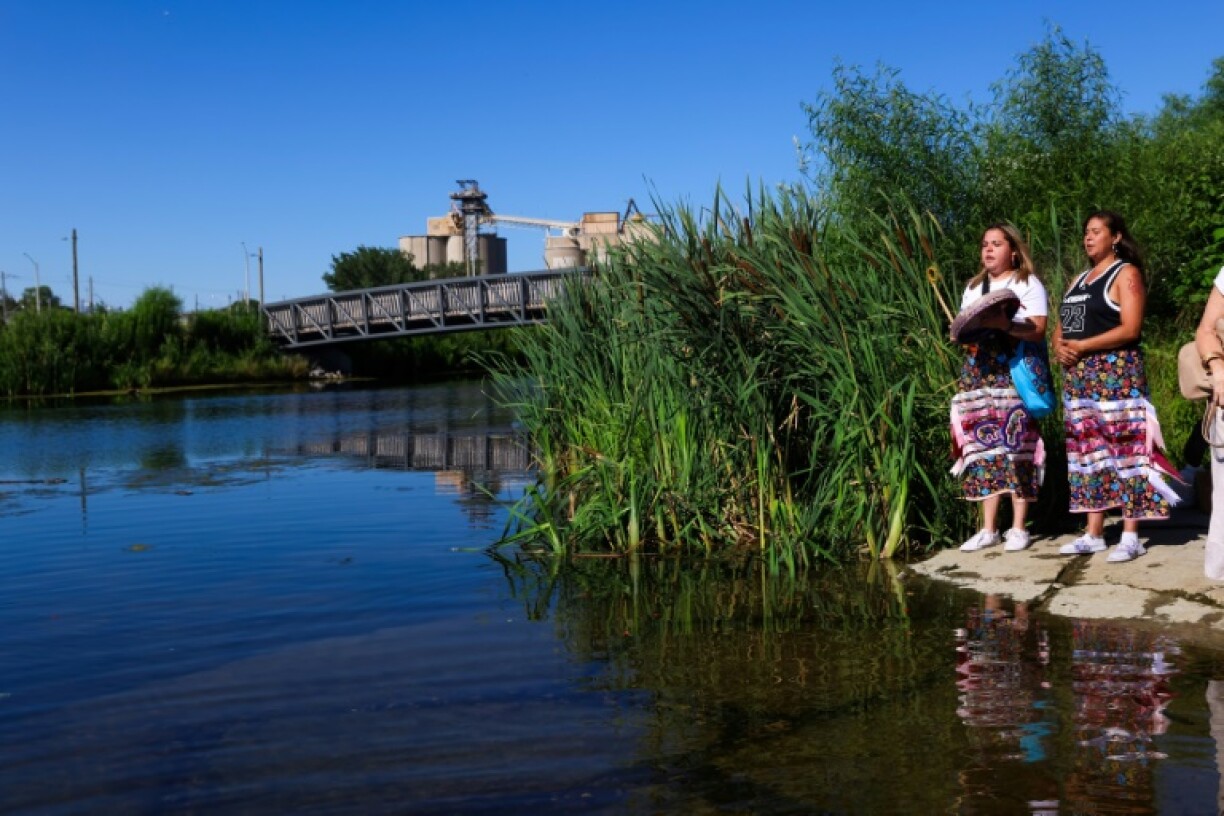 The Manitou Mkwa Signers perform a song along the banks of Don River in Toronto's Port Lands Flood Protection Project