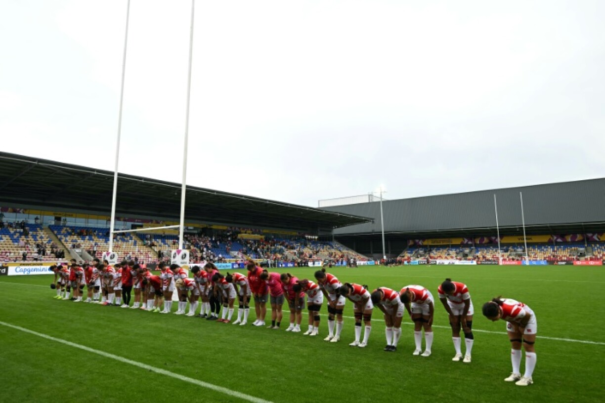 The Japan team and coaches bow to their fans after a 29-21 Women's Rugby World Cup Pool C win over Spain in York