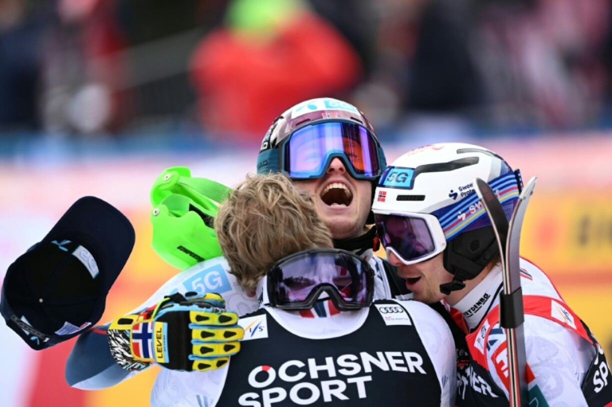 Atle Lie McGrath (C) celebrates his win with compatriots Timon Haugan (L) and Henrik Kristoffersen (R) after their Norwegian podium sweep of the World Cup slalom in Wengen