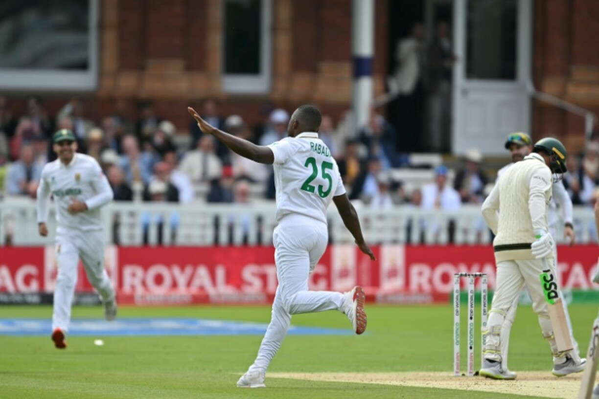 South Africa's Kagiso Rabada (C) celebrates taking the wicket of Australia's Usman Khawaja