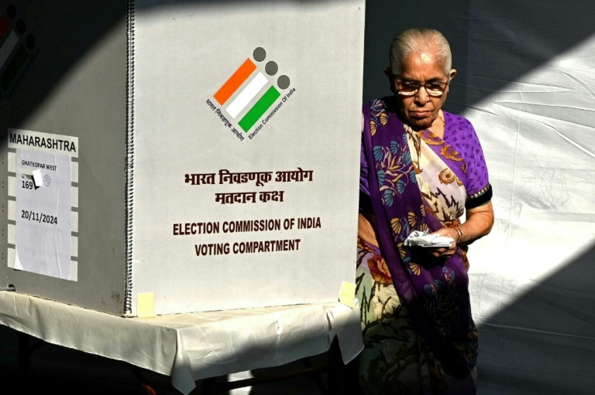 A voter leaves after casting her ballot in Mumbai