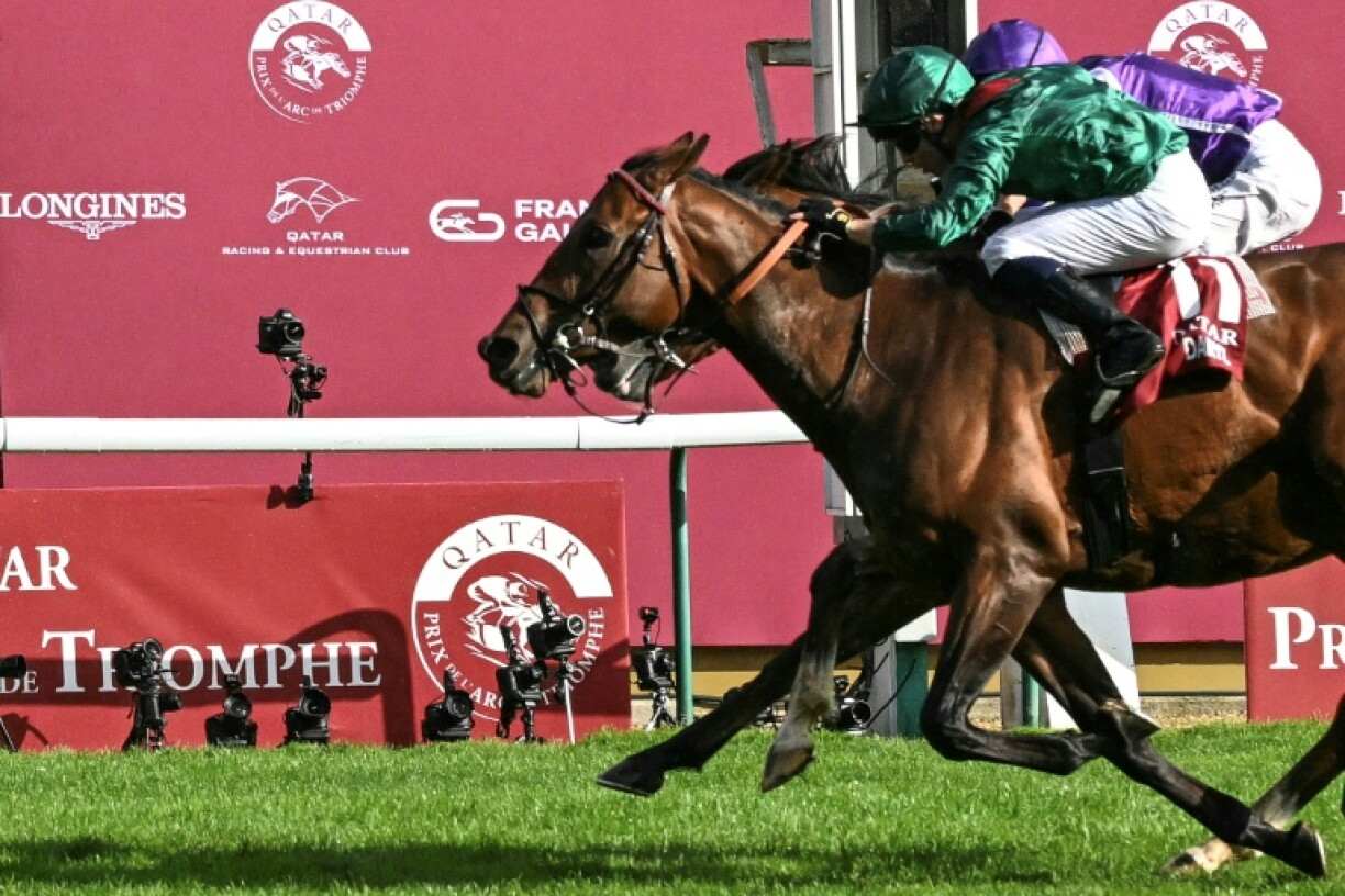 Minnie Hauk (rear) hopes to go one better this year and avenge her narrow defeat by Daryz in the Arc
