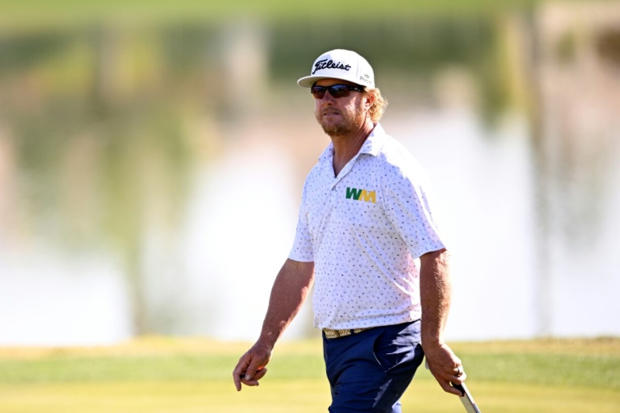 American Charley Hoffman walks on the 18th green on the way to a share of the second-round lead in the US PGA Tour American Express tournament