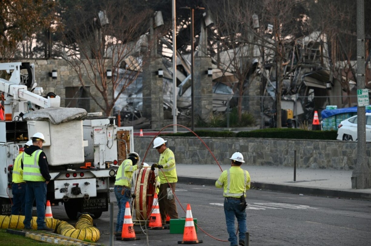 Evacuation orders were lifted for dozens of wildfire-affected neighborhoods in upscale western Los Angeles
