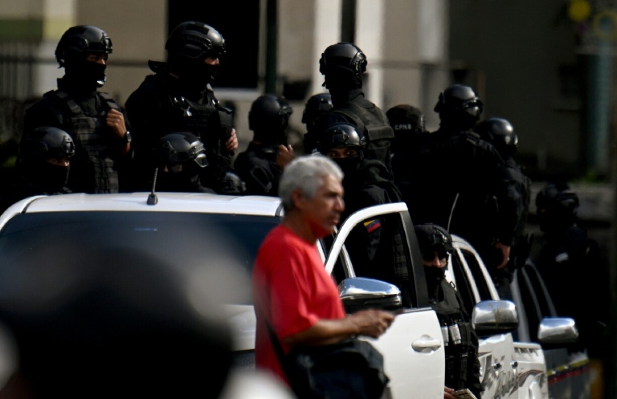 Members of the security forces are pictured in pickups during a protest called by the opposition on the eve of the presidential inauguration, in Caracas on January 9, 2025.