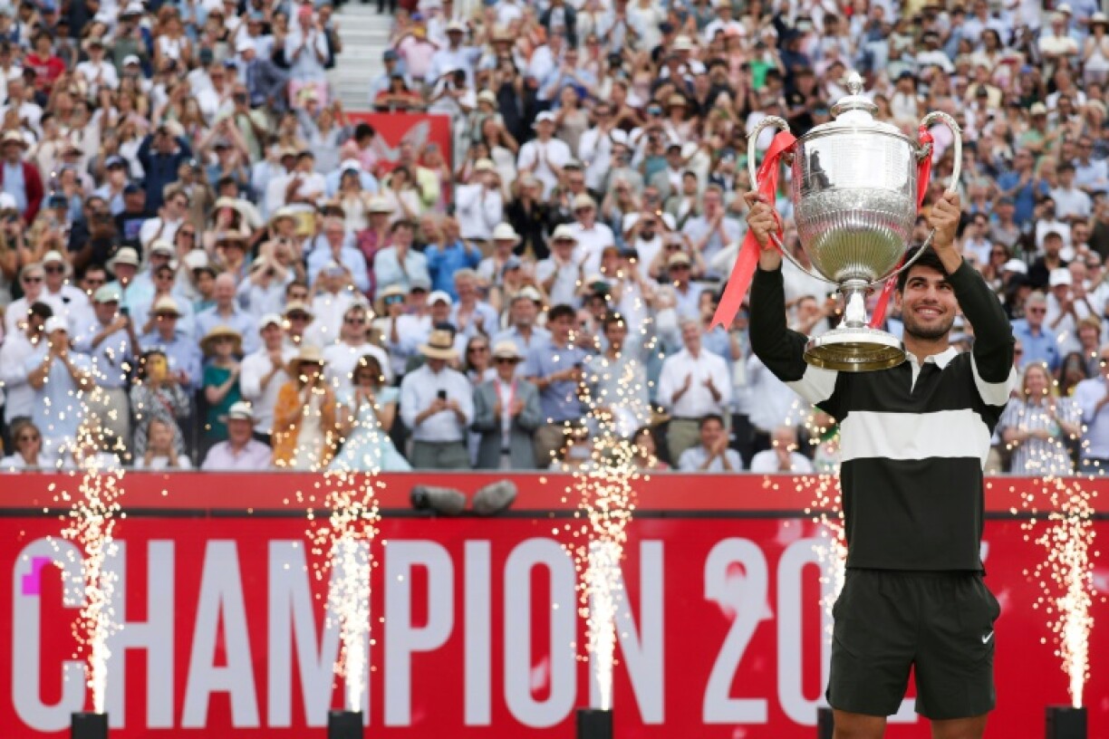 Spain's Carlos Alcaraz celebrates his second Queen's Club title before Wimbledon