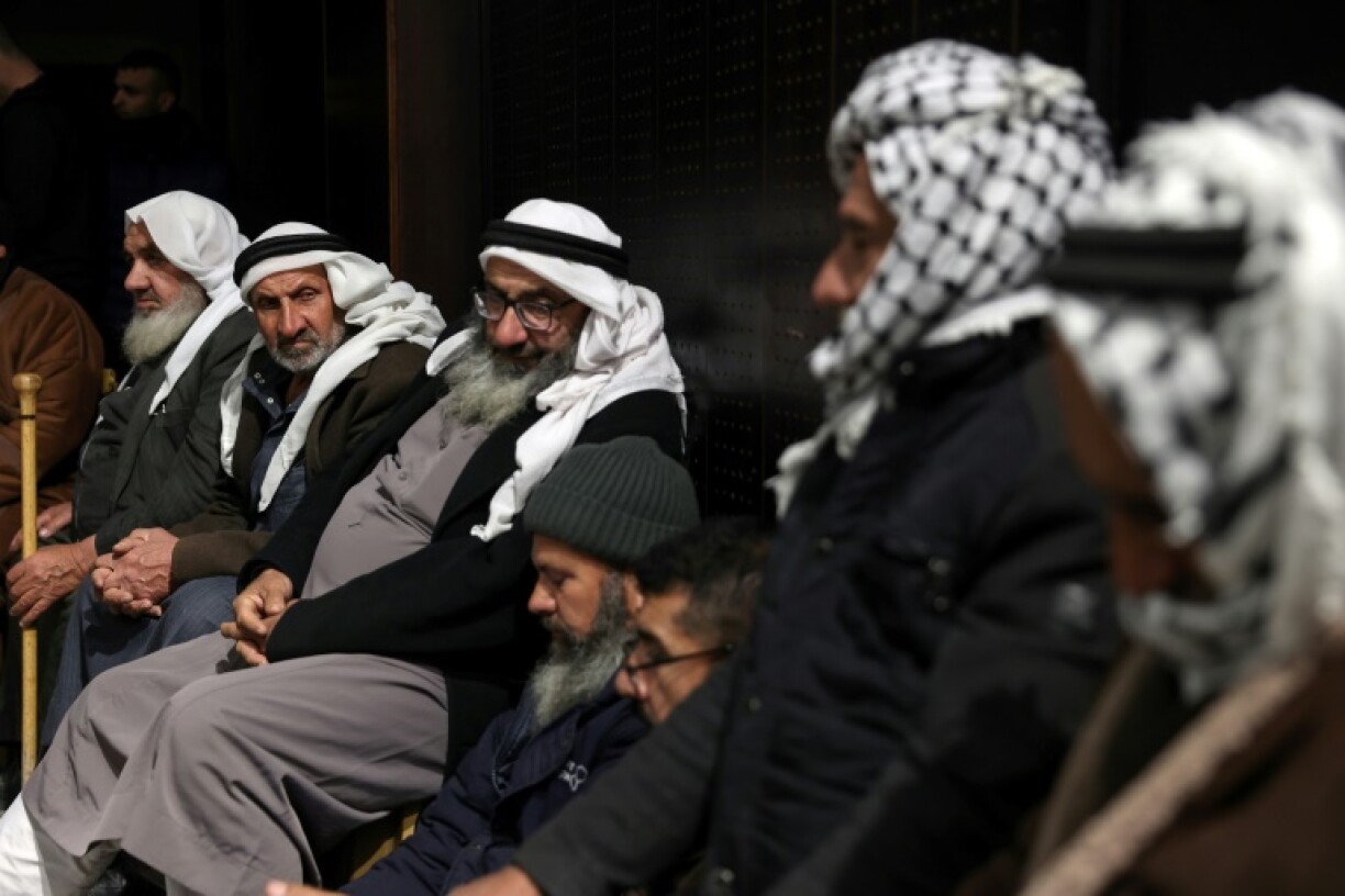 Palestinian families in Ramallah, the occupied West Bank, after Israel delayed the release of Palestinian prisoners