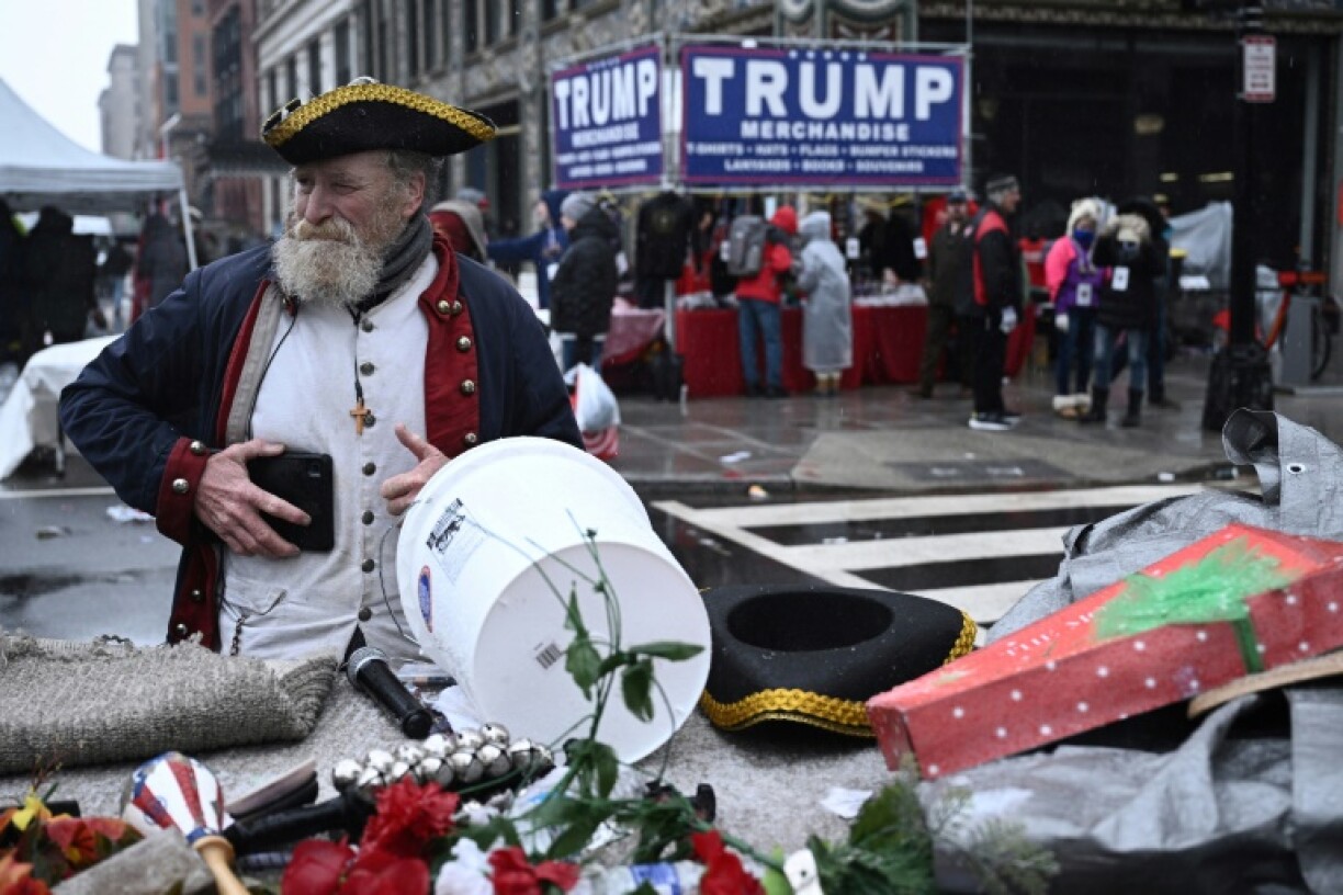 Some vendors and Trump supporters wore colonial-era uniforms as they sold Trump-branded merchandise or stood in line to enter the arena