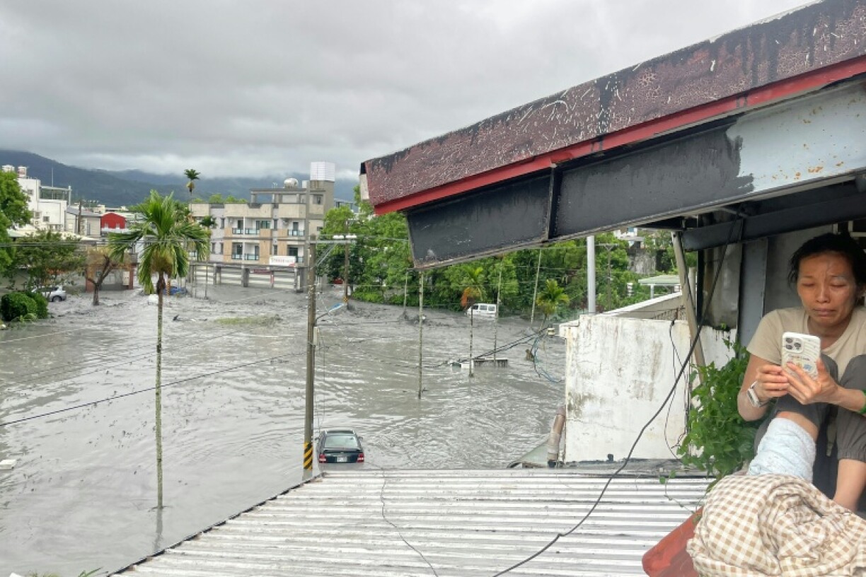 A barrier lake in eastern Taiwan burst Tuesday as Super Typhoon Ragasa pounded the island with torrential rains, flooding a nearby town and trapping over 260 people
