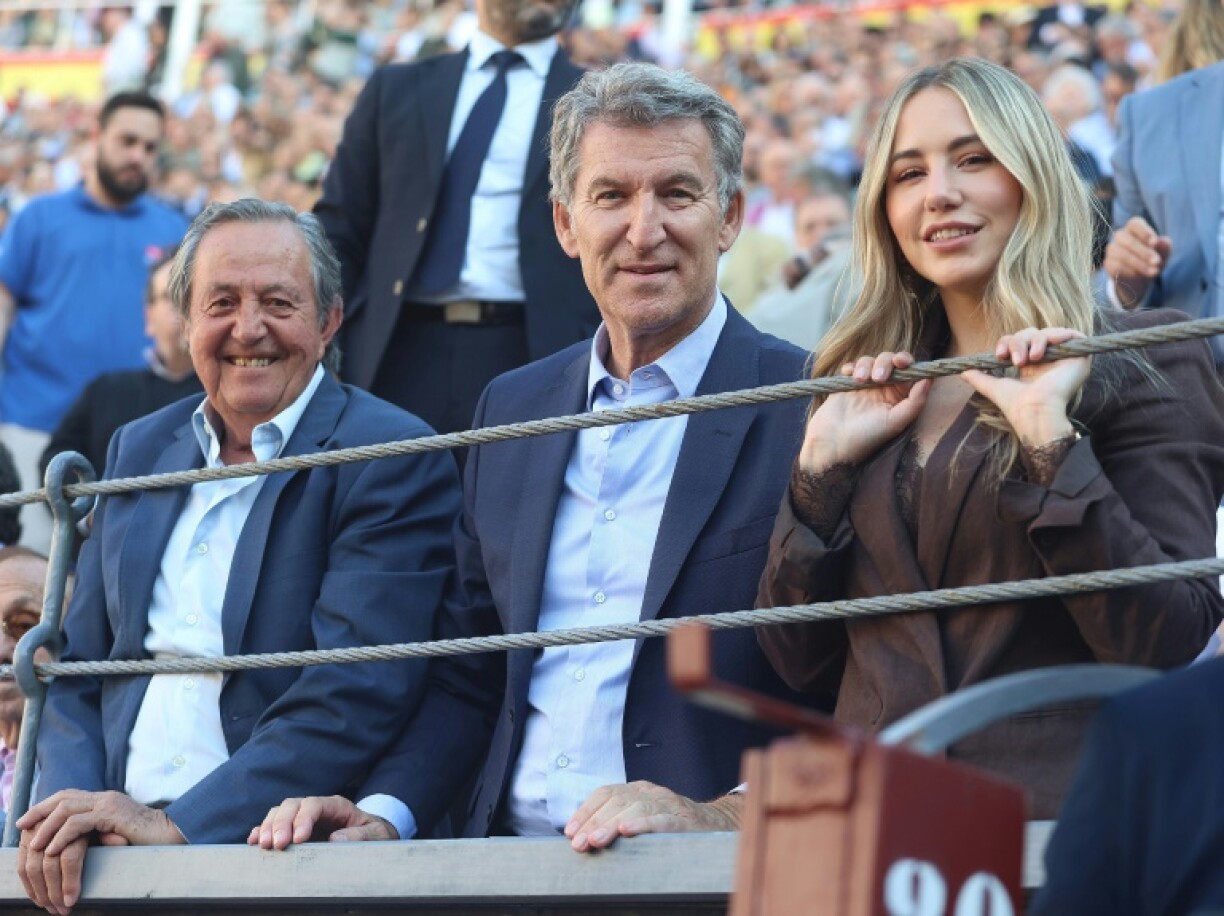 Noelia Nunez (R) resigned as an MP after it emerged she claimed to have degrees she never obtained. She is seen here attending a bullfight alongside the head of her Popular Party, Alberto Nunez Feijoo (C), and a former bullfighter, Pedro Gutierrez Moya (L) on May 22