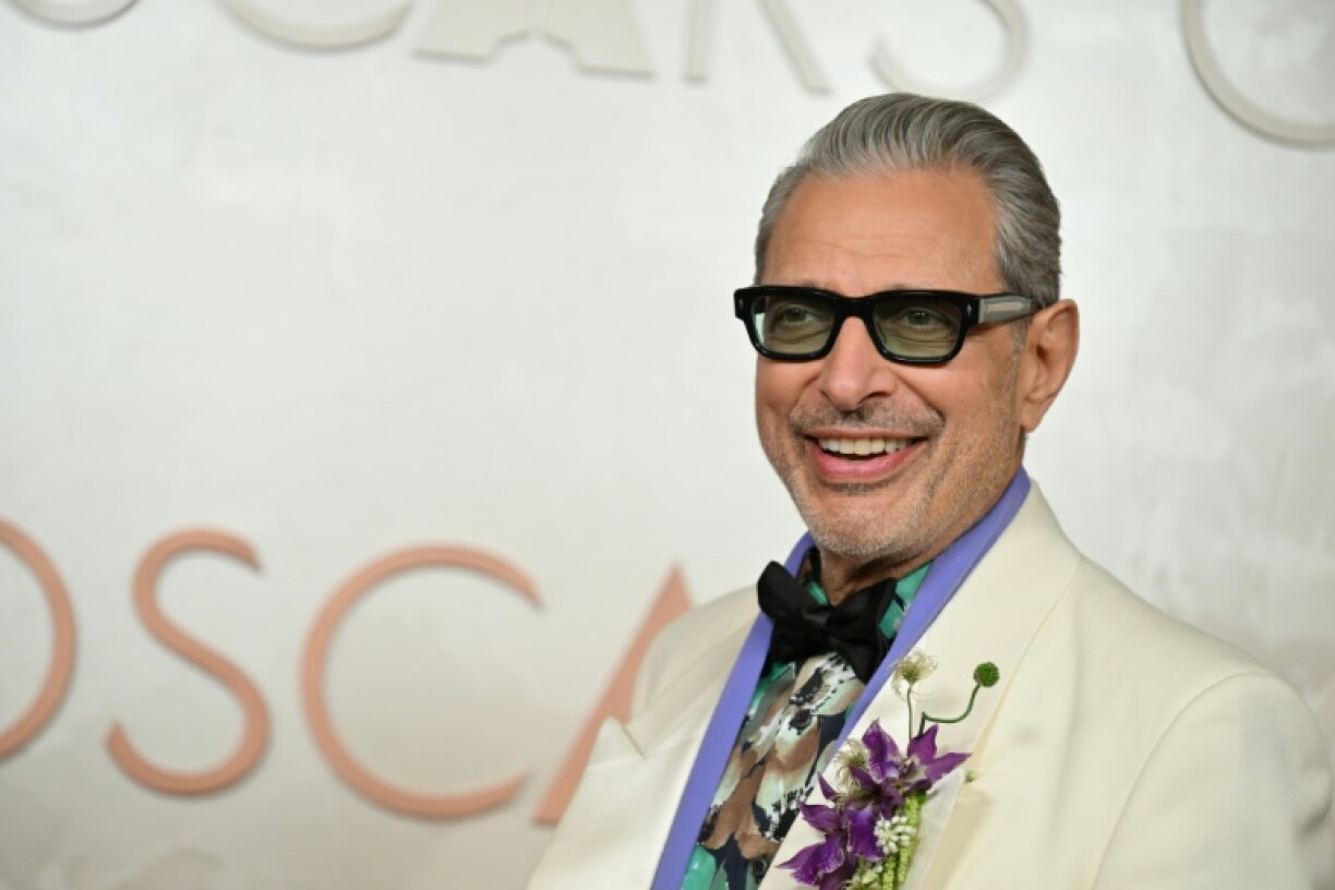 US actor Jeff Goldblum finished his outfit with a pop of purple -- a floral brooch