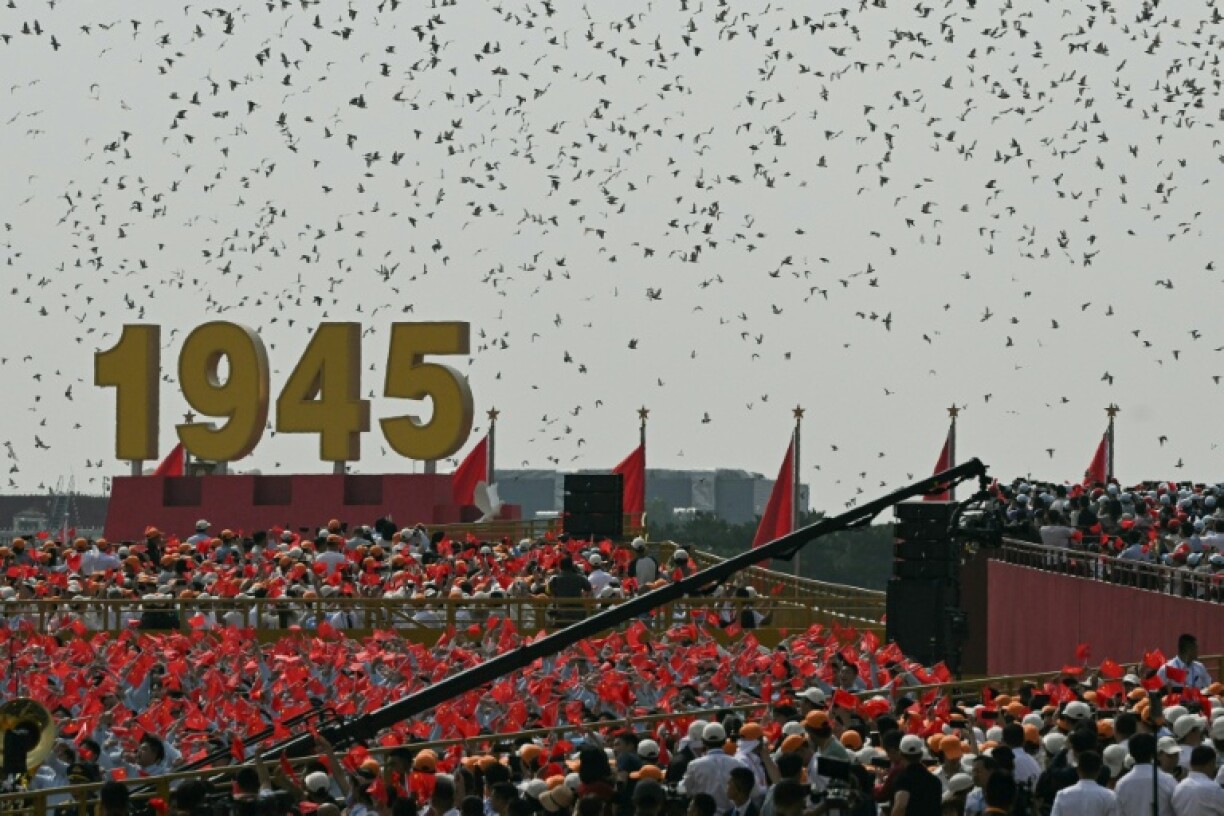 Birds are released at the end of a military parade marking the 80th anniversary of victory over Japan and the end of World War II, in Beijing’s Tiananmen Square
