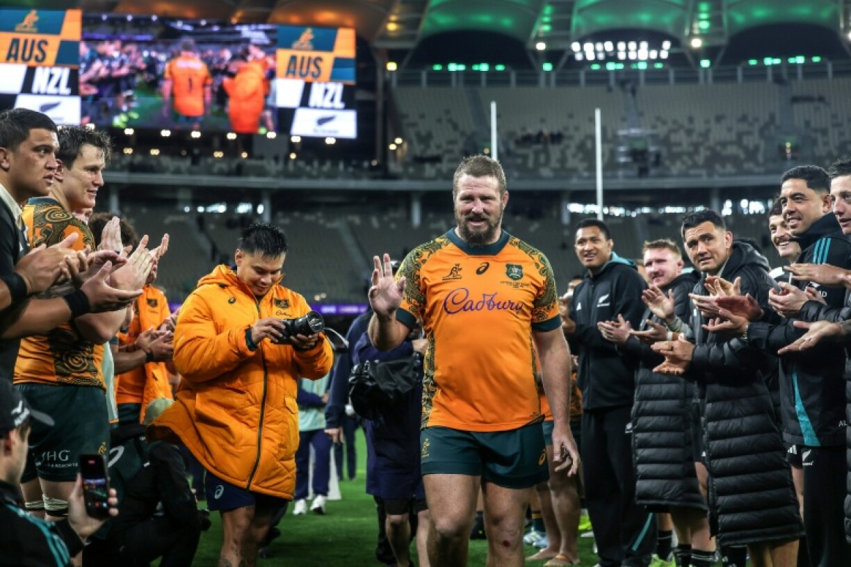 Australia's James Slipper walks down a guard of honour after playing his 151st and final Test