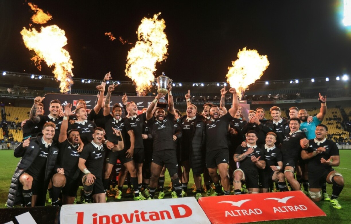 New Zealand's All Blacks players celebrate winning the series against France with a game to spare in Wellington