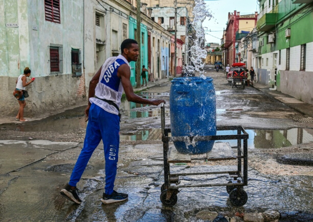 Many Cubans haul water for long distances using all kinds of instruments to transport the resource