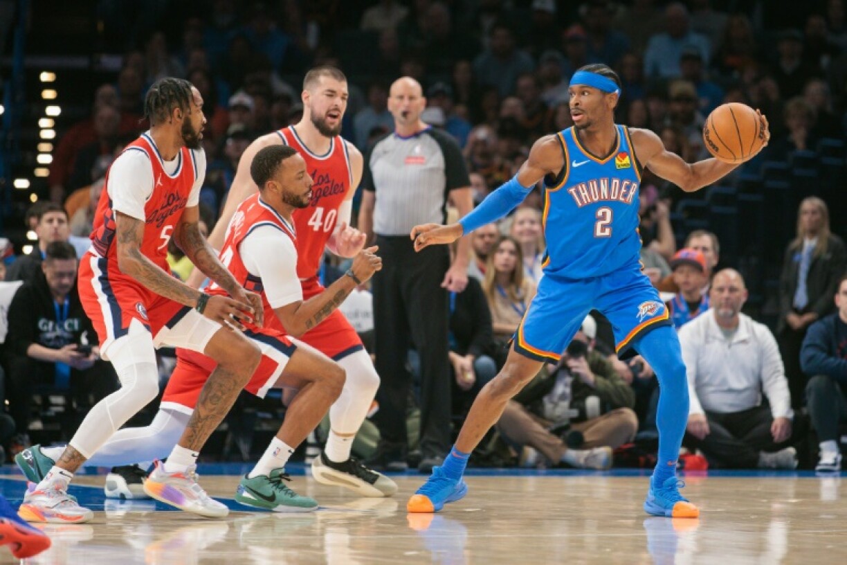 Oklahoma City's Shai Gilgeous-Alexander, right, sets the play on his way to scoring 29 points and leading the Thunder to an NBA home victory over the Los Angeles Clippers