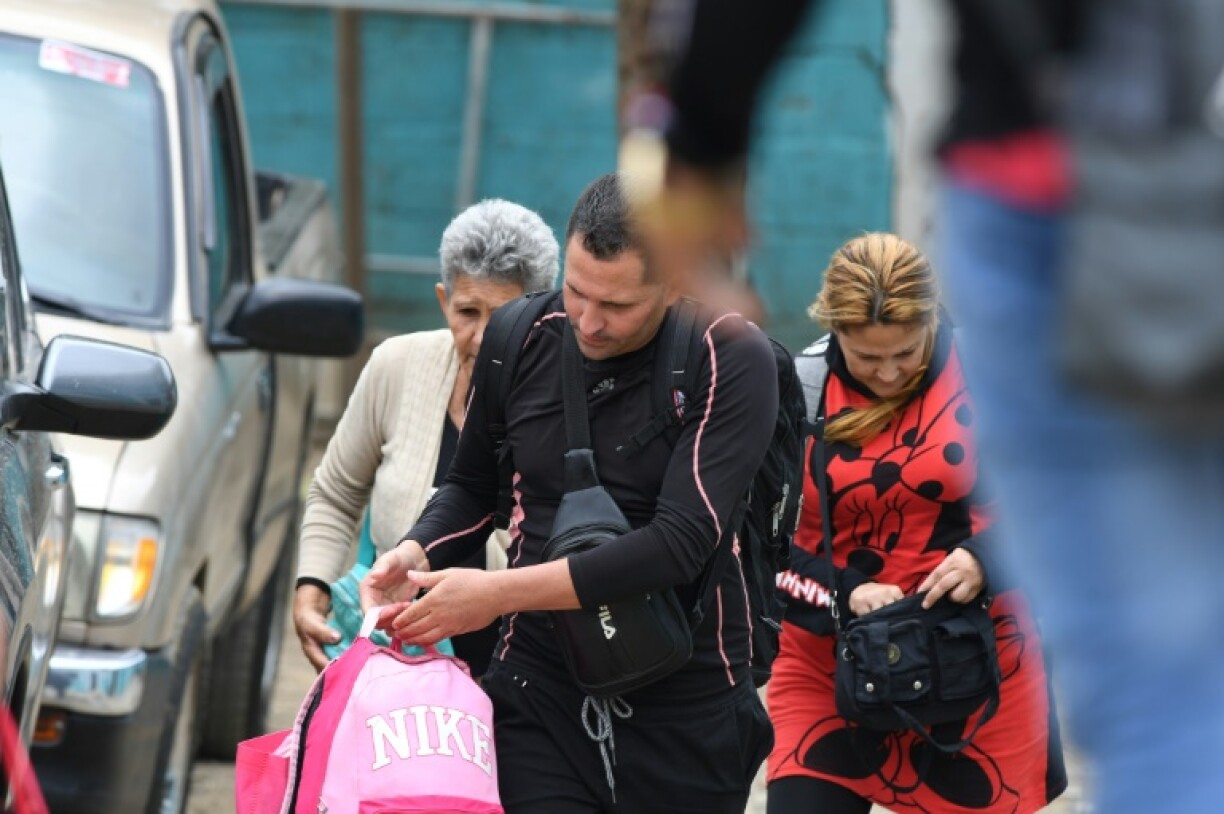 Cuban migrants leave a center after receiving permission to cross Honduran territory in Danli, 100 km east of the capital Tegucigalpa, in March 2025