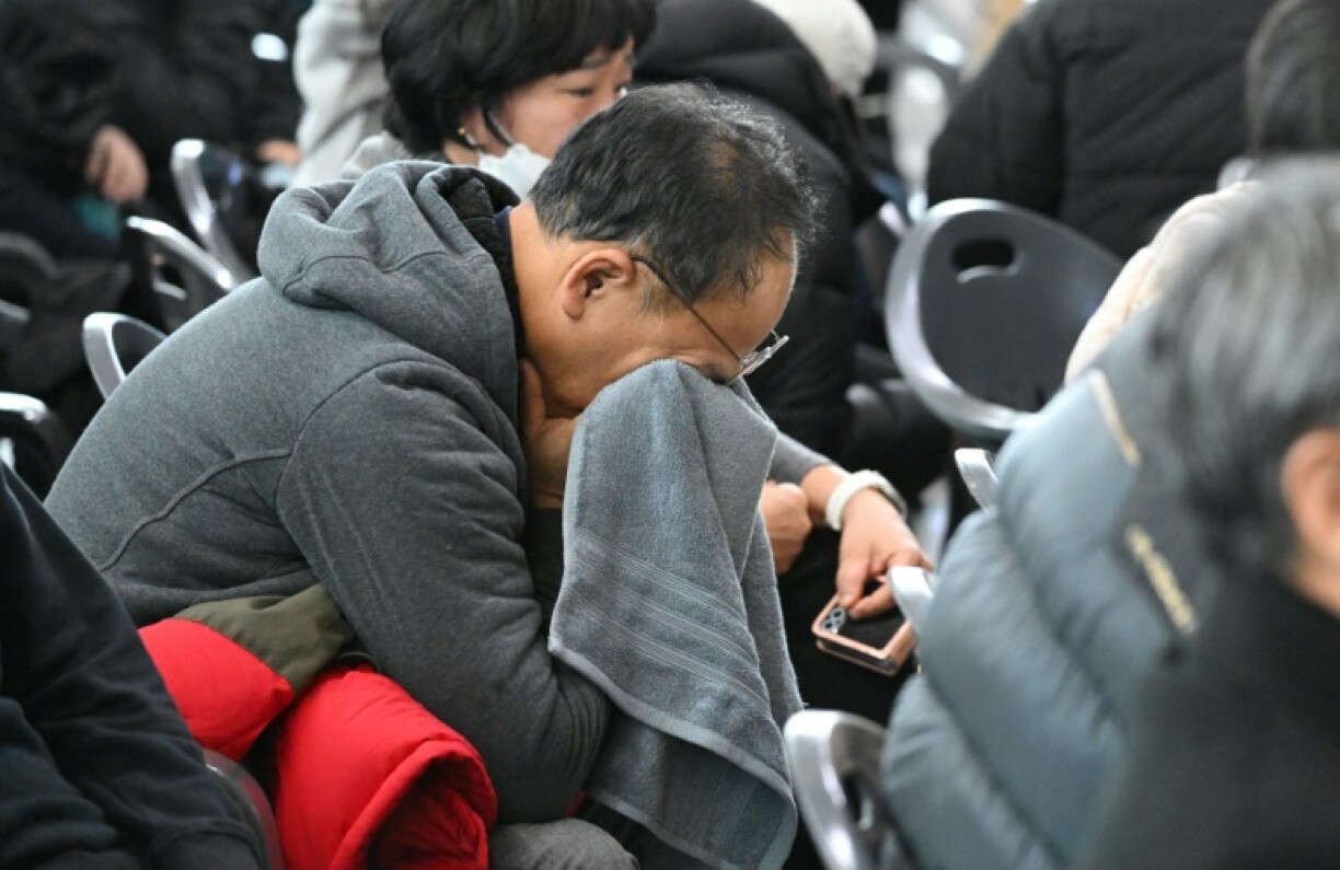 Grieving relatives wait for news of loved ones on board a Boeing 737-800 Jeju Air flight, which crashed in South Korea's worst air disaster