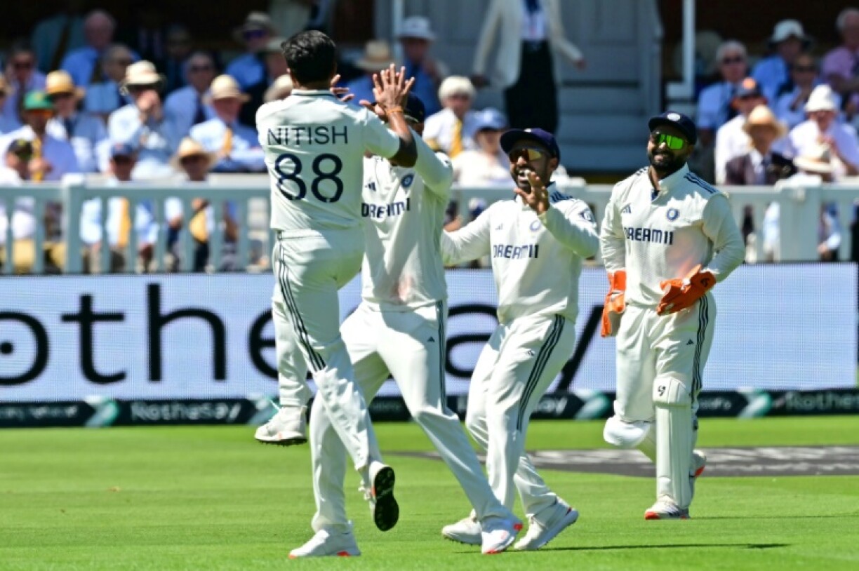 India's Nitish Kumar Reddy (L) celebrates after dismissing Ben Duckett in the third Test against England at Lord's