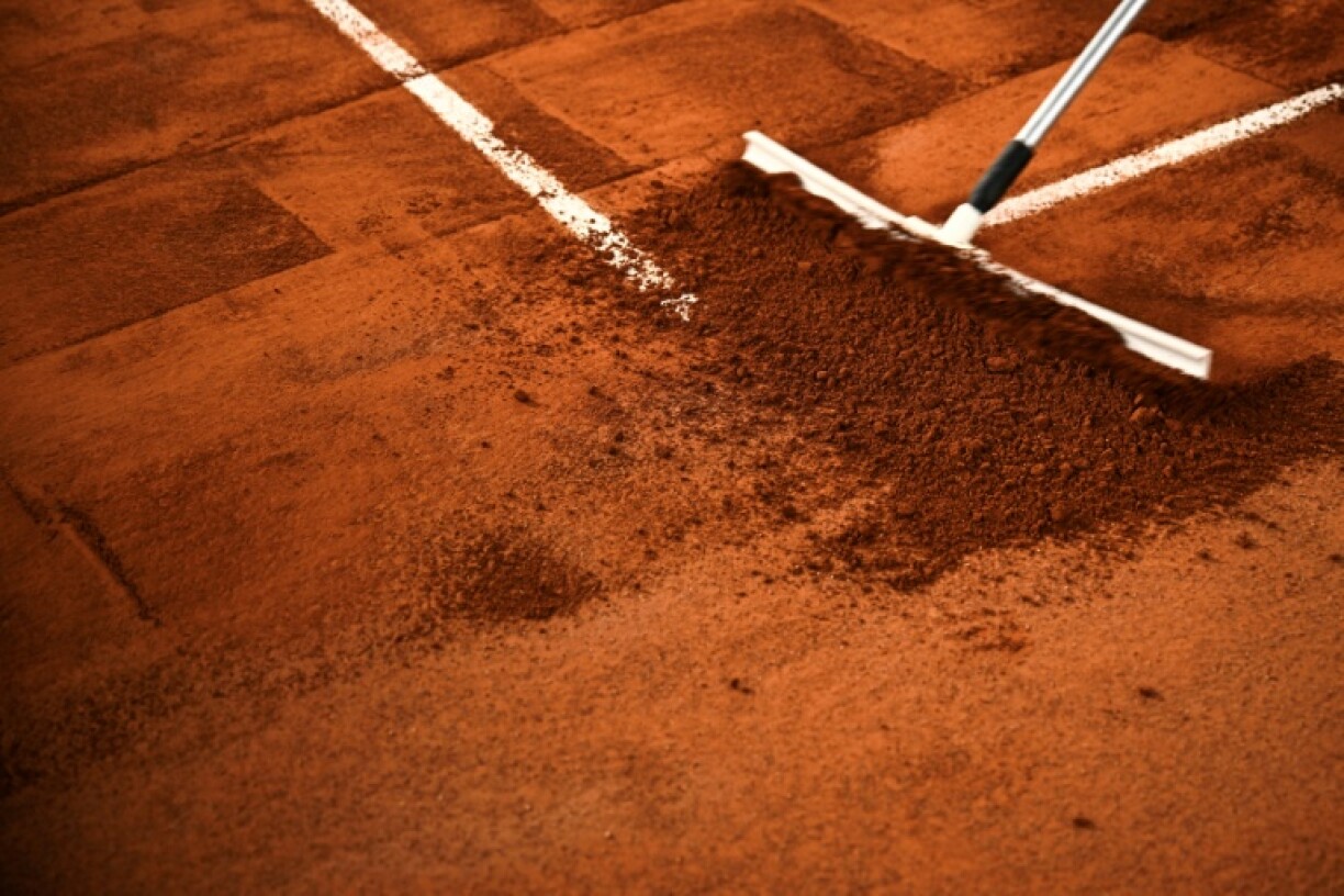 Clean sweep: A court is prepared ahead of the start of the French Open main draw on Sunday