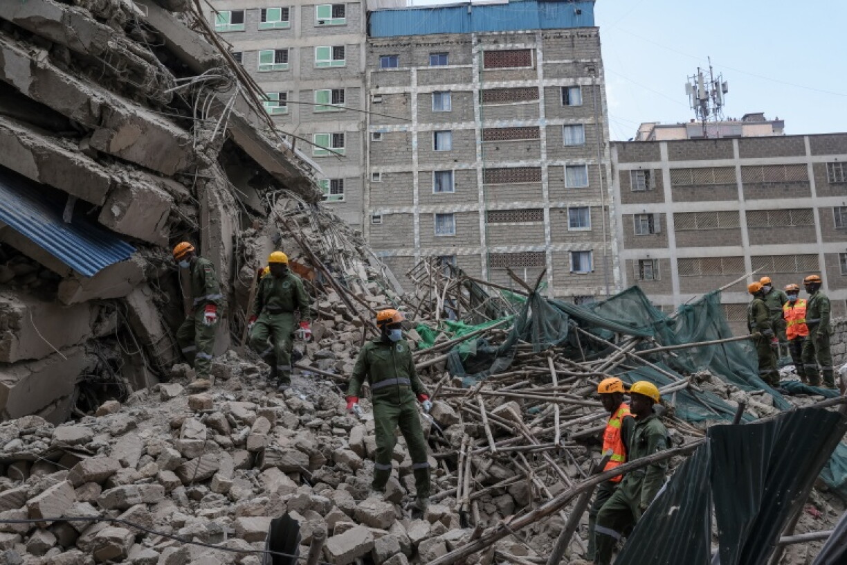 AFP journalists saw the building had been reduced to a pile of rubble as search and rescue teams arrived