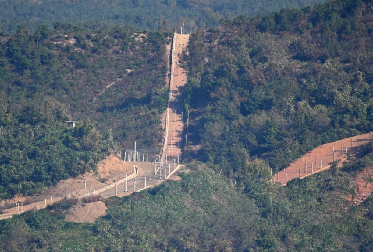 A North Korean guard post and military fences on the North side of the Demilitarised Zone dividing the two Koreas seen from a South Korean observation deck at Aegibong Peace Ecopark in Gimpo on October 27
