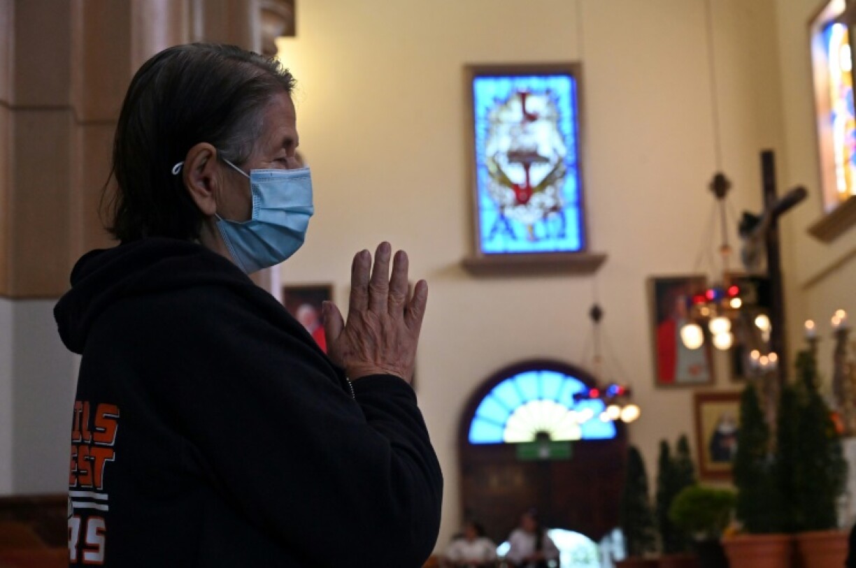 Worries about Pope Francis have spread around the world -- a parishioner prays for the pontiff's health at the Basilica of Suyapa in Tegucigalpa
