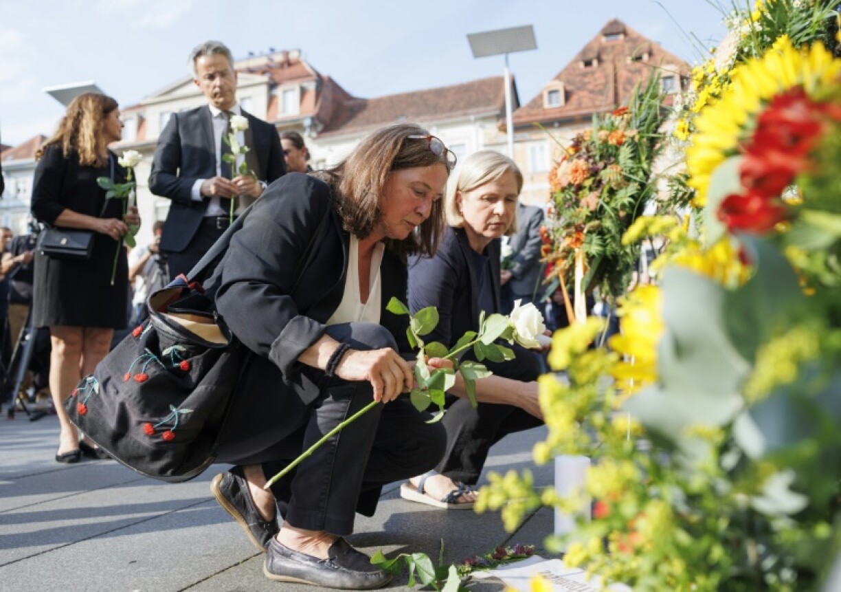 Mourners cried, hugged and left flowers, candles and letters to the victims in Graz