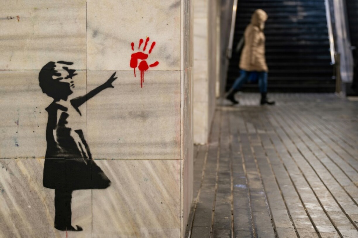 Belgrade is a graffiti haven -- this is an alternative version of Banksy's famous girl reaching for a heart-shaped, red balloon mural