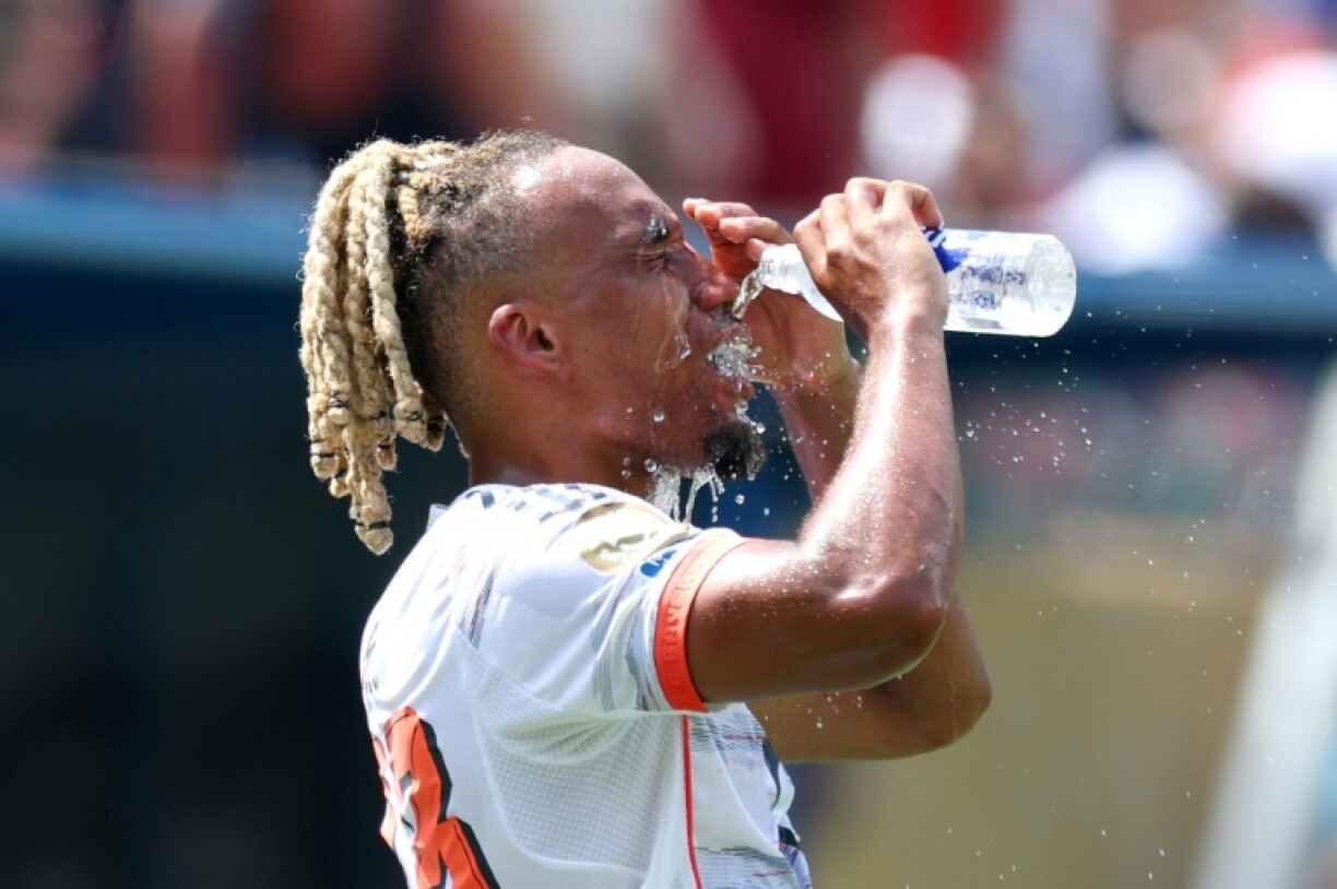 Bayern Munich's Sacha Boey takes a hydration break during his team's Club World Cup game against Benfica in Charlotte on Tuesday